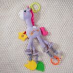 Jucarie senzoriala bebe cu elemente de dentitie si zornaitoare, Unicorn mov, 0 luni+